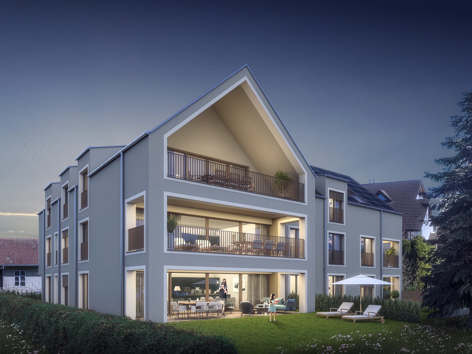 CURIA Neubau in Berg TG, Aussenansicht der Gartenseite in der Abenddämmerung mit beleuchteten Terrassen